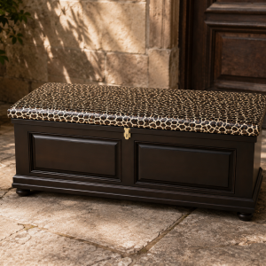 Amabala Kist shown in a stone courtyard setting, leopard-print lid and brass latch