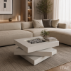 Axis swivel coffee table shown in a living room, showing the offset rotating tiers