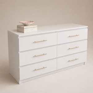 Bloom white 6-drawer chest of drawers with slim brass bar handles, styled with a scalloped dish and marble trinket box