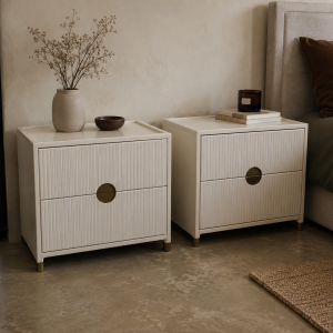 Pair of Halo pedestals shown beside a bed, showing the fluted drawer fronts and brass pulls