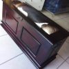 Isiko Kist shown in a bedroom, cowhide lid detail visible
