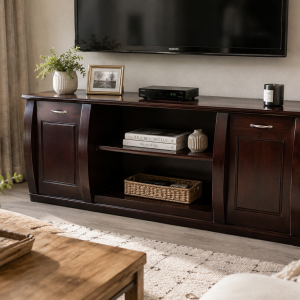 Regent cherry wood TV stand shown in a living room beneath a mounted television